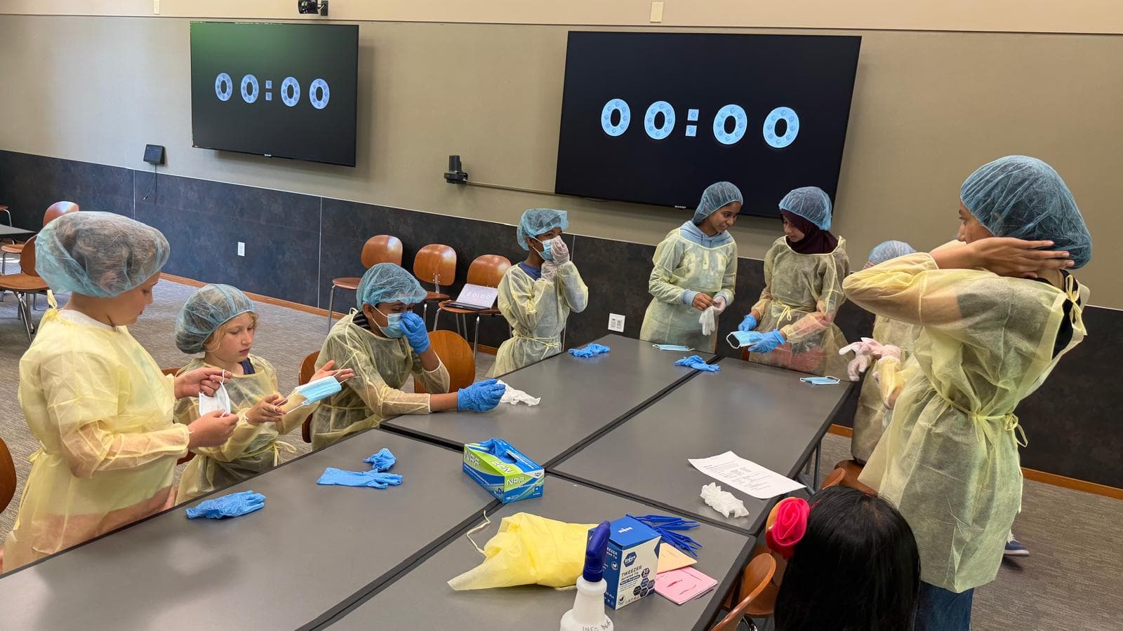Students preparing protective equipment