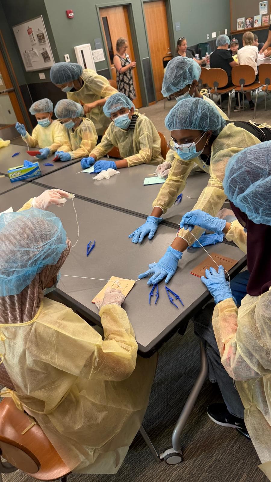 Students practicing suturing together